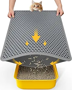 Cat litter mat measuring 23.2'' x 14.6'', trapping litter with textured surface and non-slip base, placed in front of a litter box.